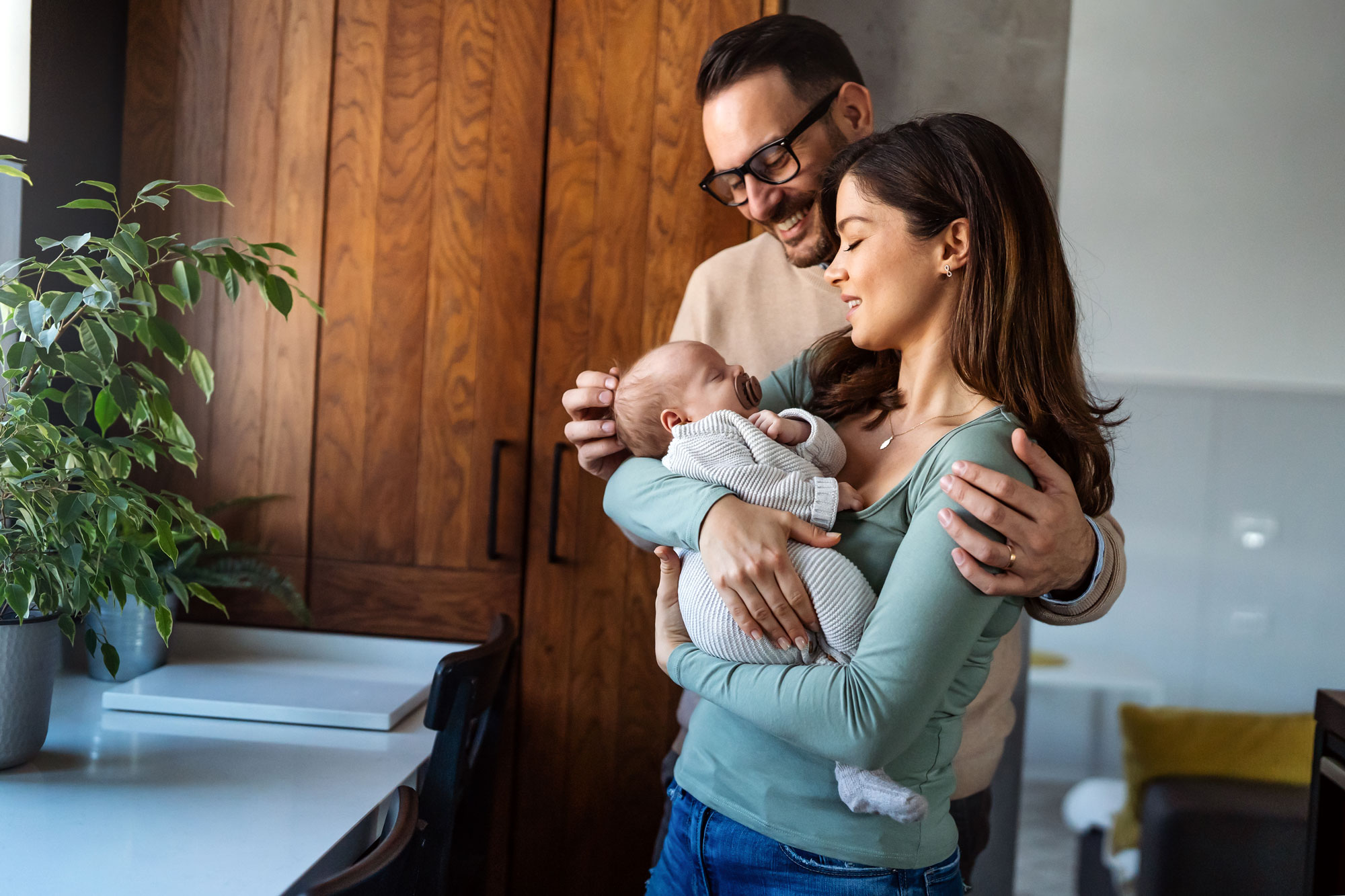 Two parents and a newborn baby