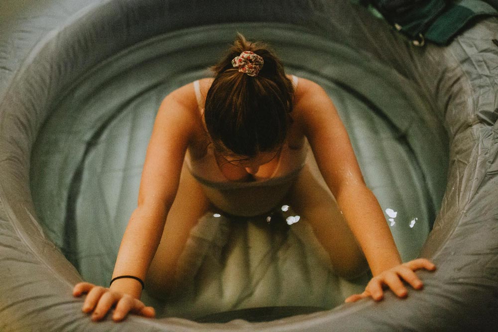 Woman sitting in a birth pool